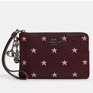 Coach Burgundy Wristlet with Light Pink Stars